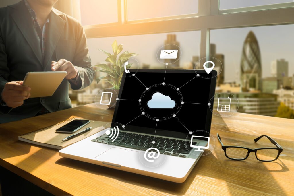 laptop with cloud computing symbols